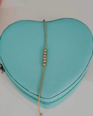 Pulsera con bolitas dorada
