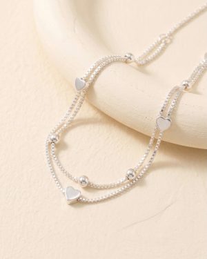 Pulsera doble con corazones